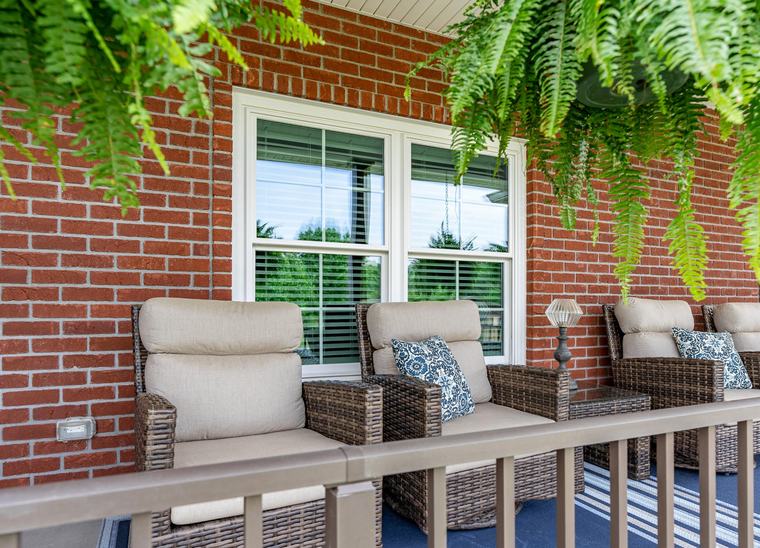 ProVia double-hung replacement windows with cottage grids in white